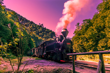 Old black steam powered railway train. Restored old vintage steam train built at Resita, Romania.