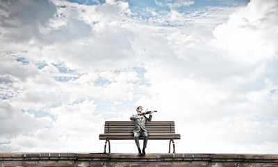 Businessman play violin