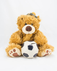 Fuzzy teddy bear with a ceramic ball for saving money.