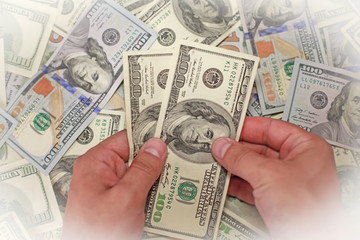 Male hand holding money, blurry effect