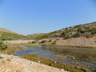 Sea, hills and blue sky