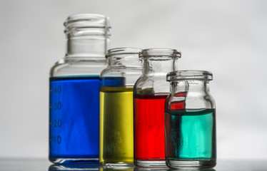 Set of laboratory bottles with color liquid