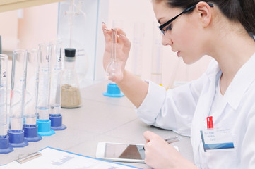 young scientist in glasses working at the laboratory