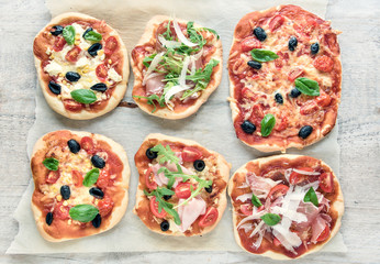 variety of small pizzas