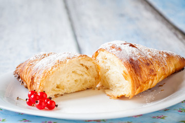 Croissant split with red currants