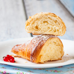 Croissant split with red currants