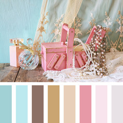 vintage jewelery, antique wooden jewelry box and perfume  with palette color swatches