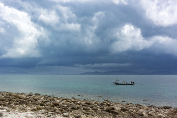 fisherman boat hide from big rain storm