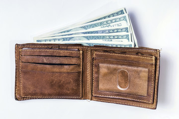 Dollar bills in a wallet 
