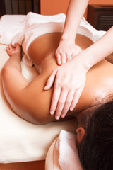 Obraz na płótnie Canvas woman getting a massage at a health and beauty spa