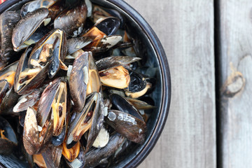 Steamed fresh mussels with wine in a pot.