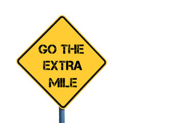 Yellow roadsign with Go The Extra Mile message