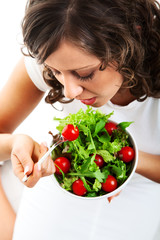Young woman preparing healhty salad