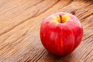 Apple on old wooden floor