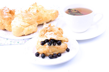 Choux pastry meringue cake with vanilla cream and fresh black currants
