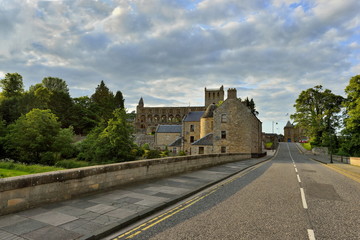 Fototapeta na wymiar Jedburgh Abbey, in the background Scottish Borders