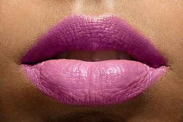 Closeup of beautiful  woman lips purple