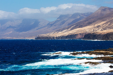 Sea surf on the rocks in area  Punta Pesebre  on Fuerteventura