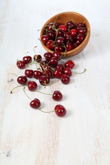 Ripe cherry in a wooden bowl