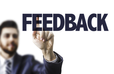 Business man pointing the text: Feedback