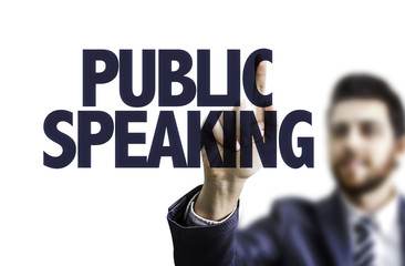 Business man pointing the text: Public Speaking