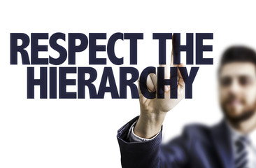 Business man pointing the text: Respect the Hierarchy