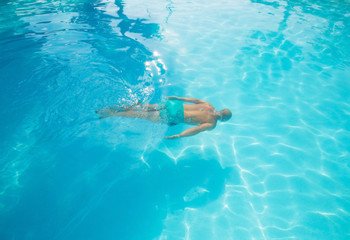 Diving in a swimming pool top angle