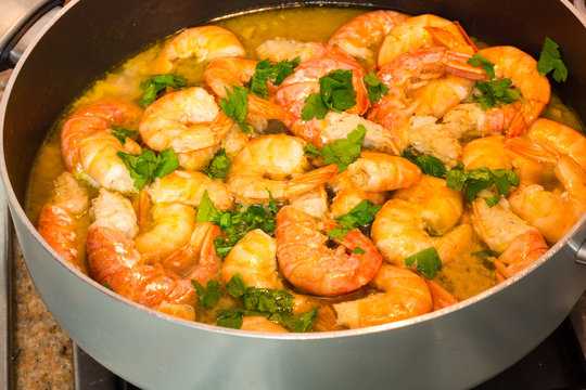 Shrimp cooking with parsley