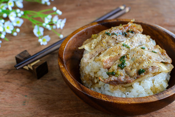 Salt and black pepper grilled pork with Japanese Rice in wooden