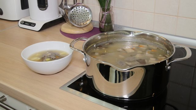 Ready-made mushroom soup on the stove and in the plate
