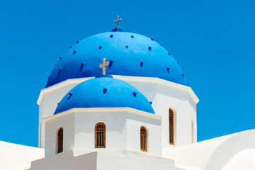 Greek church with blue dome in Santorini