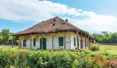 Fototapeta na wymiar Press house in ruins near vineyard
