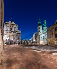 Krakow, Poland, night view of Saint Mary Magdalene square with catholic churches of Saints Peter and Paul and Saint Andrew