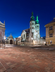 Fototapeta na wymiar Krakow, Poland, romanesque church of Saint Andrew on Mary Magdalene square in blue hour, winter morning.