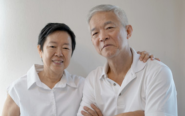 Happy Asian senior couple on white background love and hug