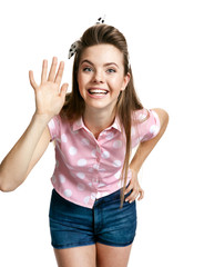 Smiling girl showing her hand up, greeting gesture 