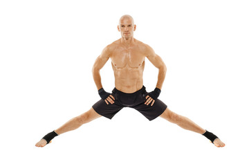 Kickboxer executing a split