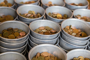 Coin donation to Thai temple