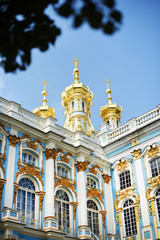 Fototapeta na wymiar Golden cupolas of Catherine Palace church on the sky background