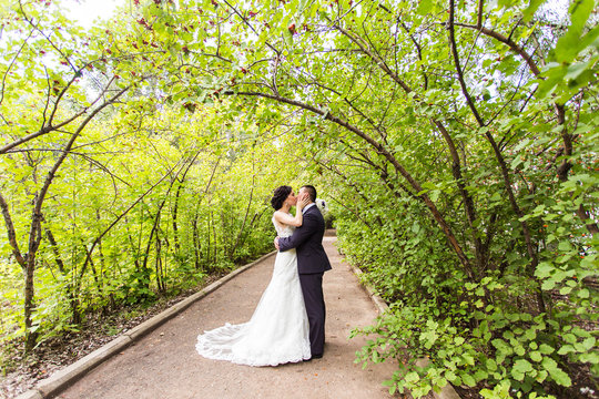 Bride and Groom at wedding Day walking Outdoors on autumn nature