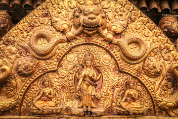 Fototapeta na wymiar Golden reliefs closeup