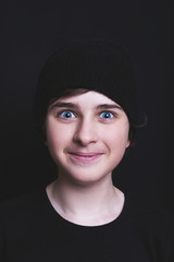 Portrait of a teen boy in a black cap