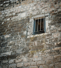 view of jail wall and window
