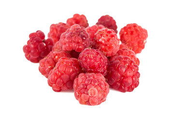 Close-up of a group of ripe red raspberries, isolated on white background.