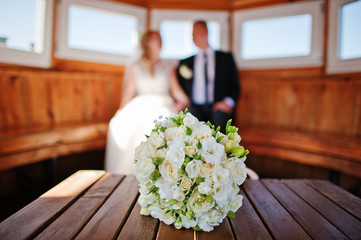 wedding couple on a ship cabin