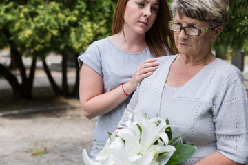 Caring granddaughter supporting her grandma