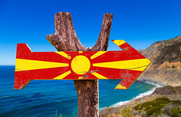 Macedonia Flag wooden sign with coast background