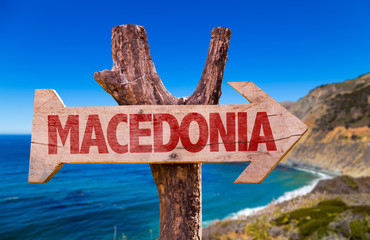 Macedonia wooden sign with coast background