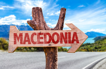 Macedonia wooden sign with road background