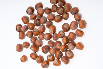 Pile of hazelnuts isolated on white background